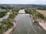 Aerial view of a completed hydroelectric project with a river.