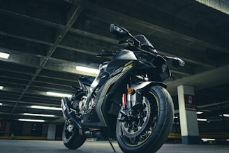 Sleek electric motorcycle parked in an urban setting with dramatic lighting highlighting its modern design.