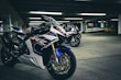 High-performance motorcycle apparel showcased in an urban setting.