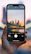 Man outdoors using an iPhone with a city skyline in the background.