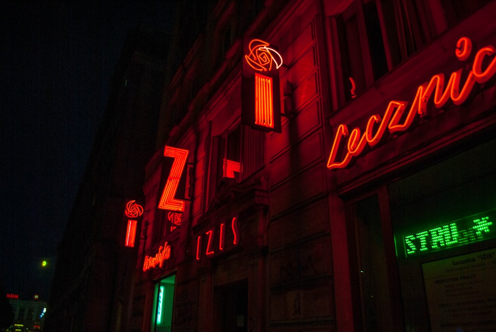 a building with neon signs on the side of it