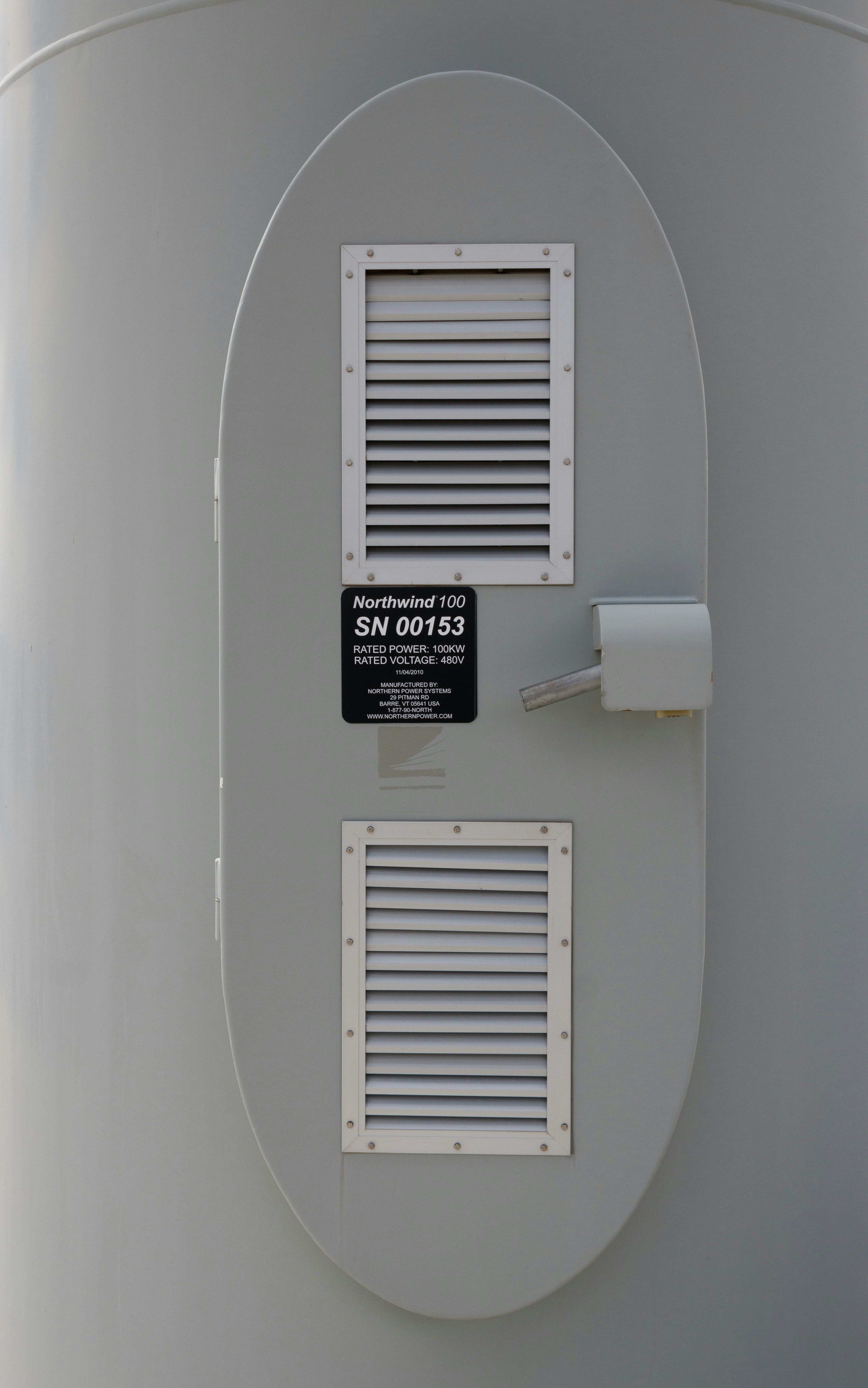 a sign on the side of a large tank