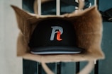 An assortment of printed merchandise including bags and caps.