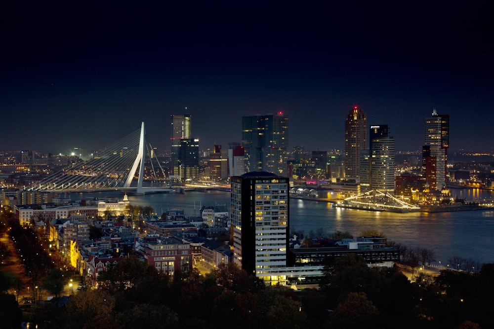 a view of a city at night from a hill