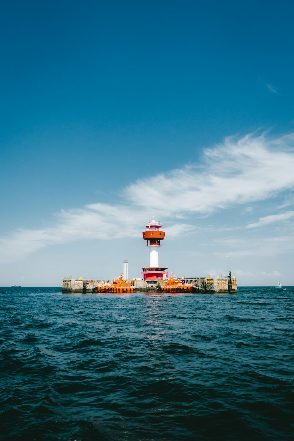 a light house in the middle of the ocean