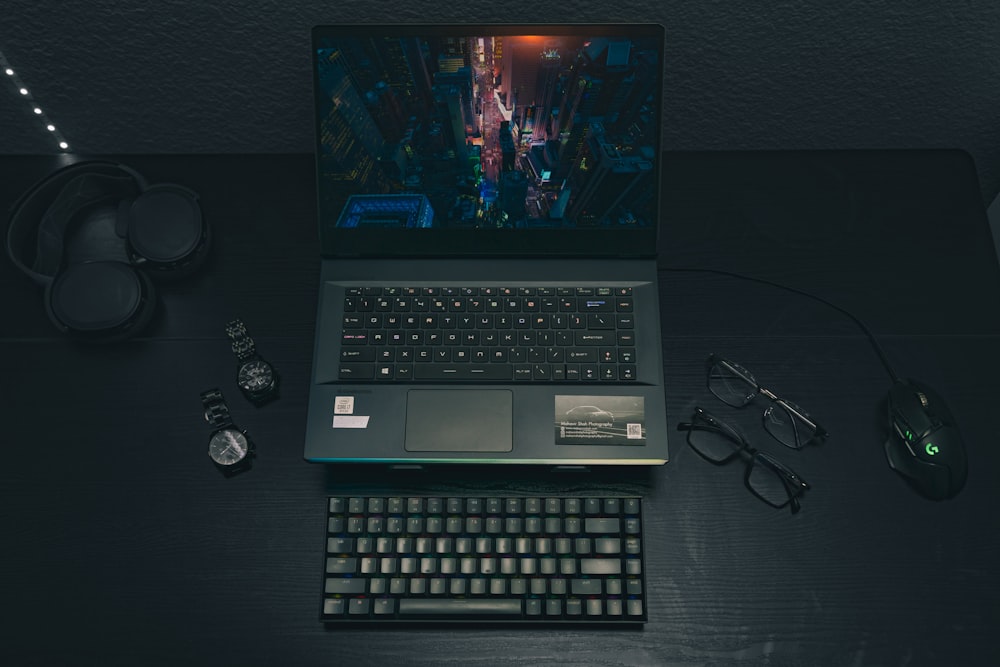 a laptop computer sitting on top of a wooden desk