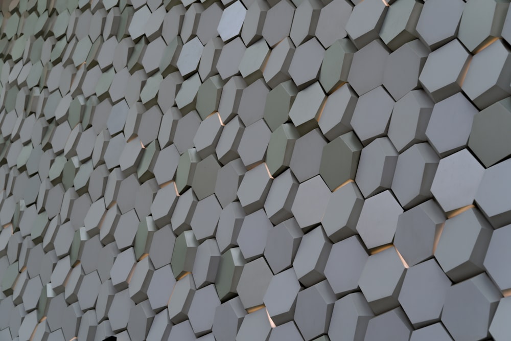 a close up of a wall made of hexagonal tiles