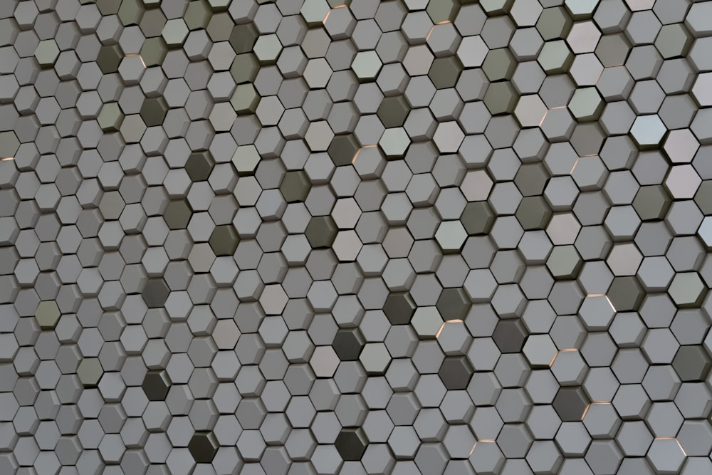 a close up of a wall made of hexagonal tiles