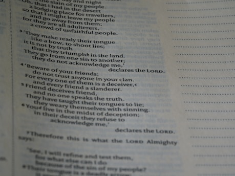 A close-up of a page with text, possibly from a religious or spiritual book, featuring numbered paragraphs and a structured layout. The text is clearly printed and fills the left side of the page, with margins and a dotted line on the right.