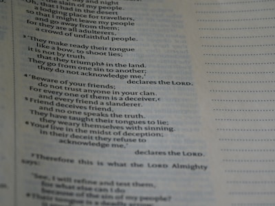 A close-up of a page with text, possibly from a religious or spiritual book, featuring numbered paragraphs and a structured layout. The text is clearly printed and fills the left side of the page, with margins and a dotted line on the right.