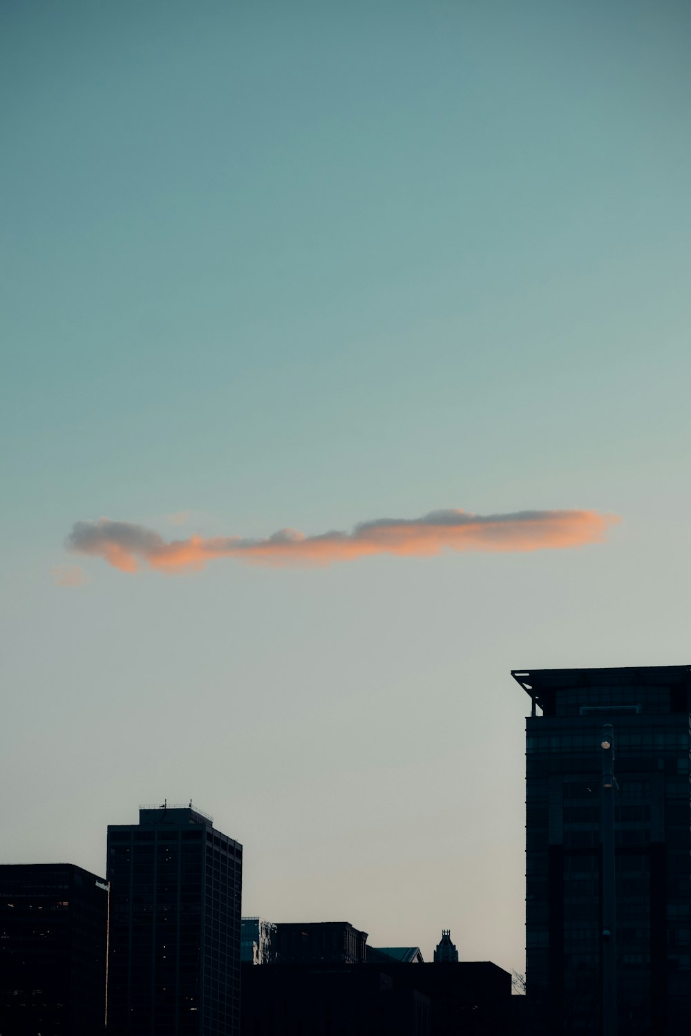a cloud in the sky over a city