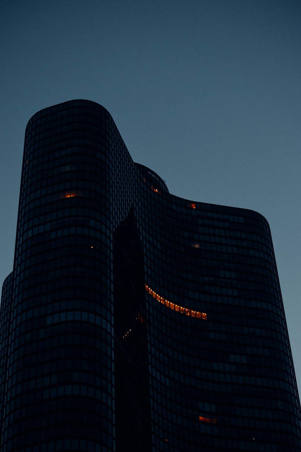 a very tall building with a clock on it's side