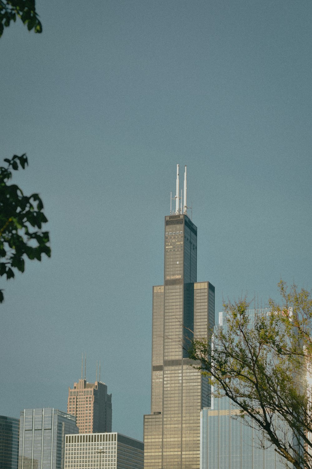 a tall building with a clock on the top of it