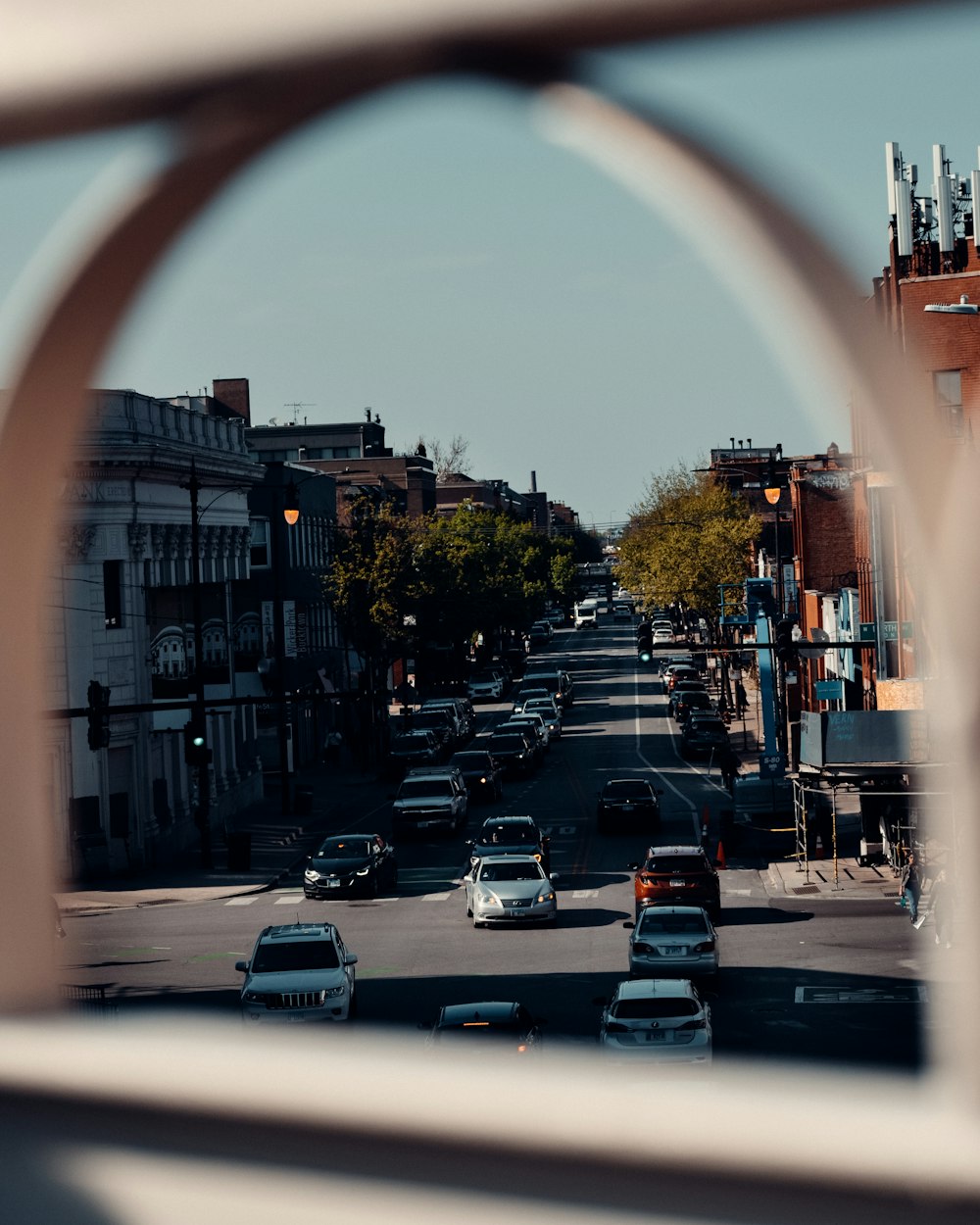 a view of a city street through a window