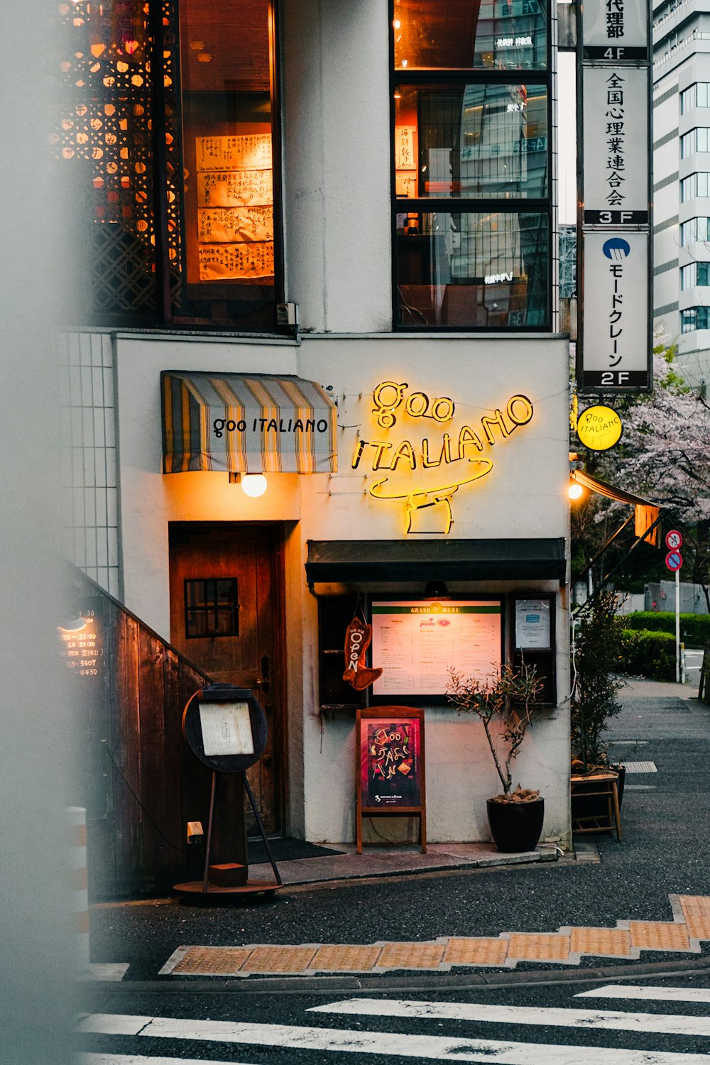 a building with a neon sign on the side of it