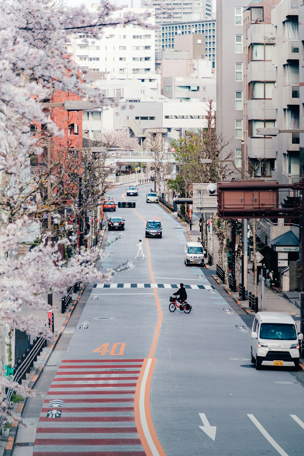 a person riding a bike on a city street