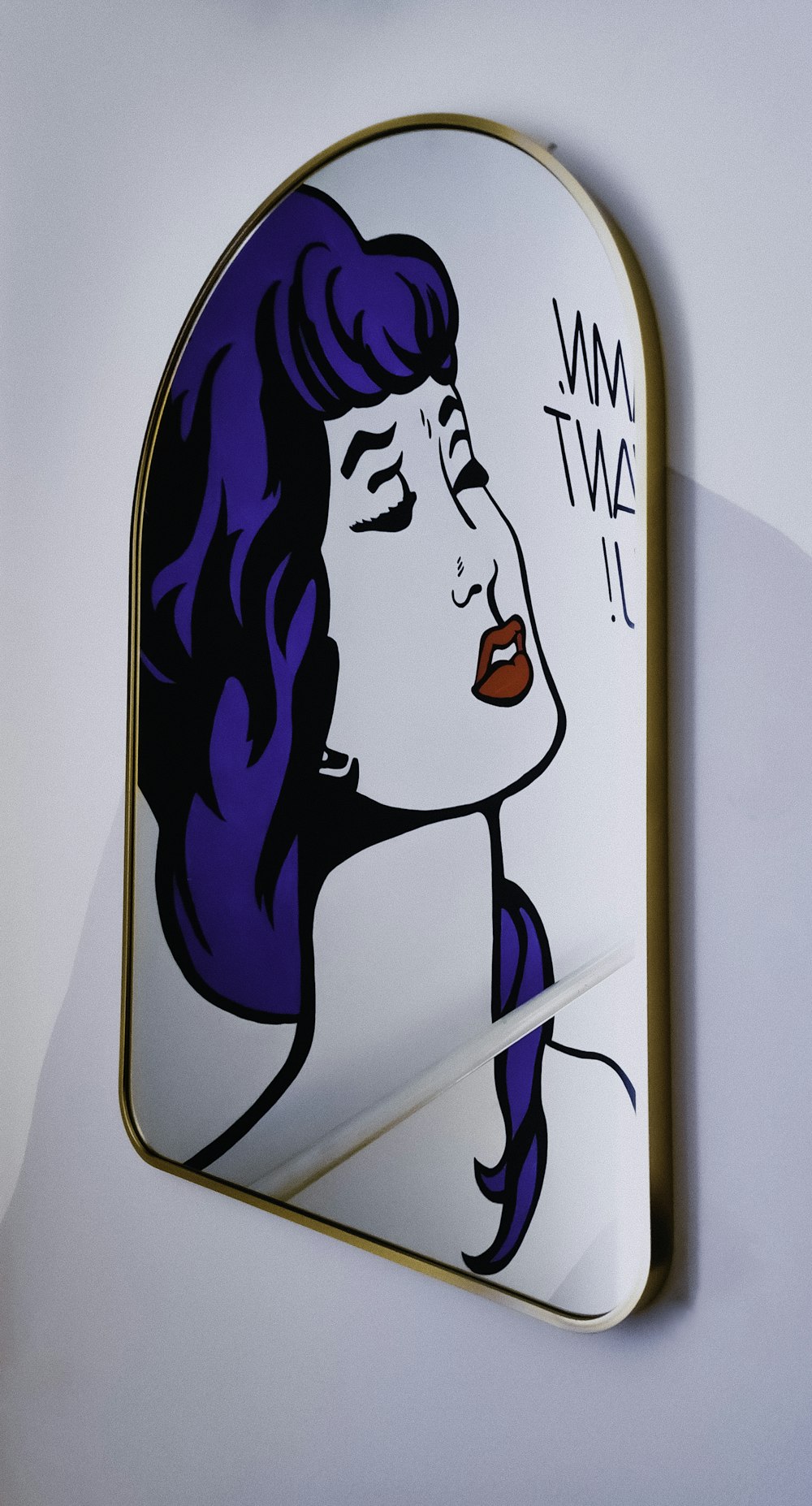 a picture of a woman's face on a mirror