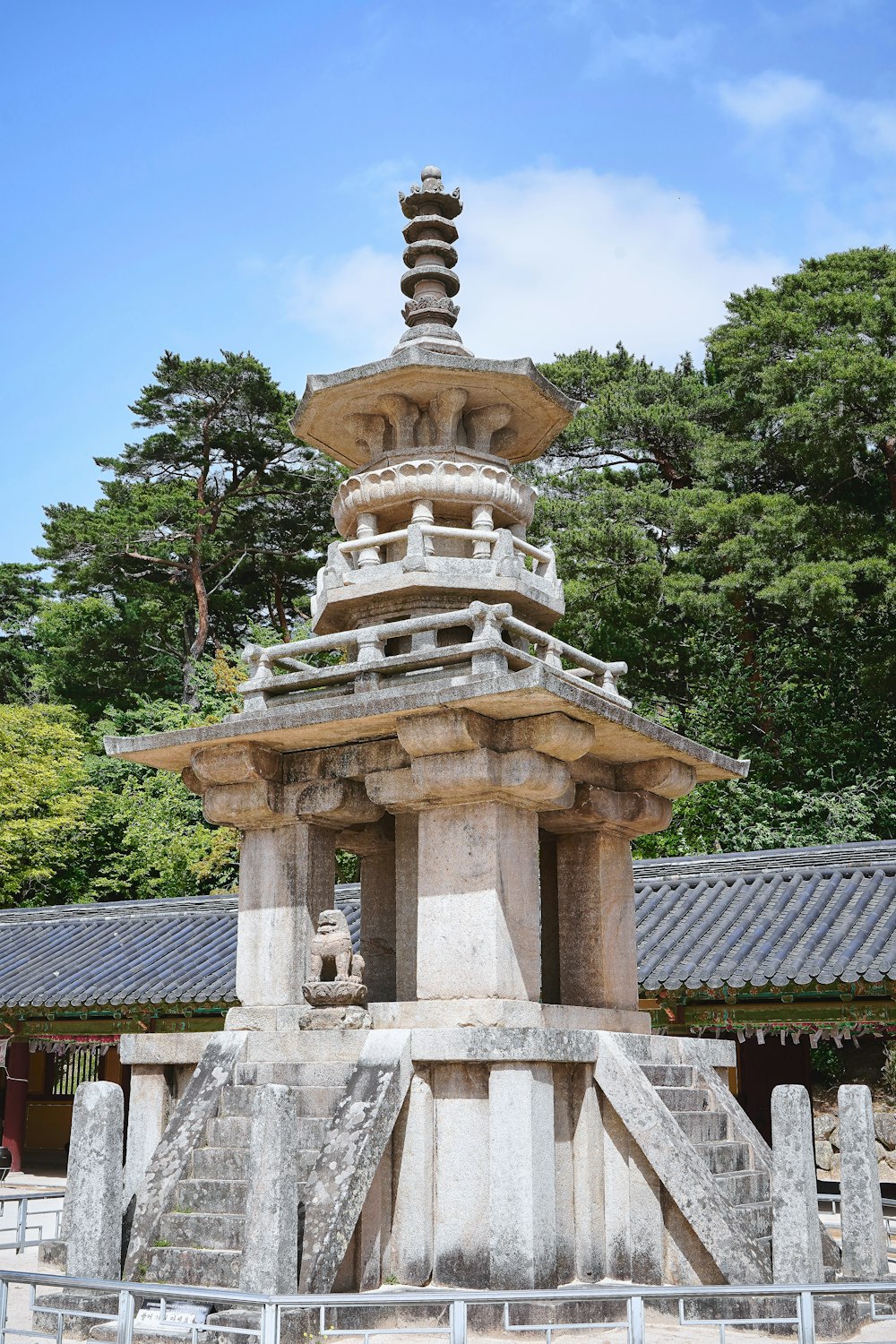 a stone structure with a pagoda on top of it