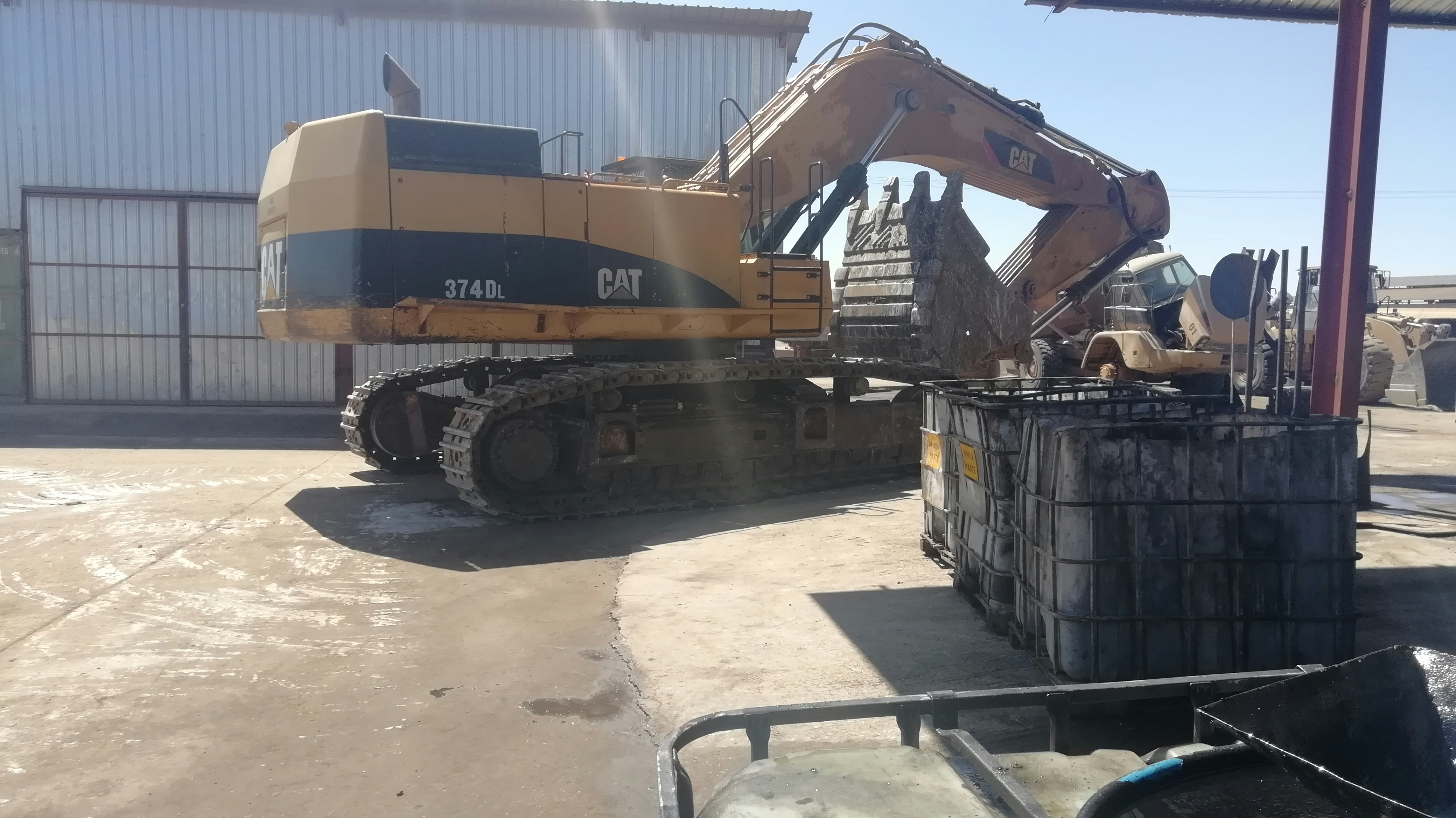 Yellow industrial air compressor on construction site, industrial equipment, outdoor setting