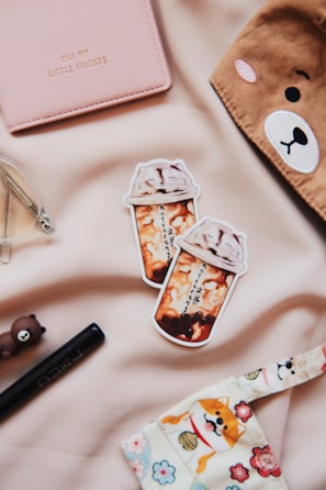 A butter yellow bundle showcasing a playful toy, a notebook with kawaii stickers, and matching pens.