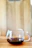 A warm, inviting coffee cup on a wooden table with soft morning light.