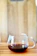 A warm, inviting coffee cup on a wooden table with soft morning light.