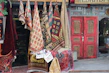 A cozy display of colorful handwoven door mats at an inviting doorstep.