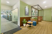 A welcoming office space in Ajman with a friendly consultant assisting a client.