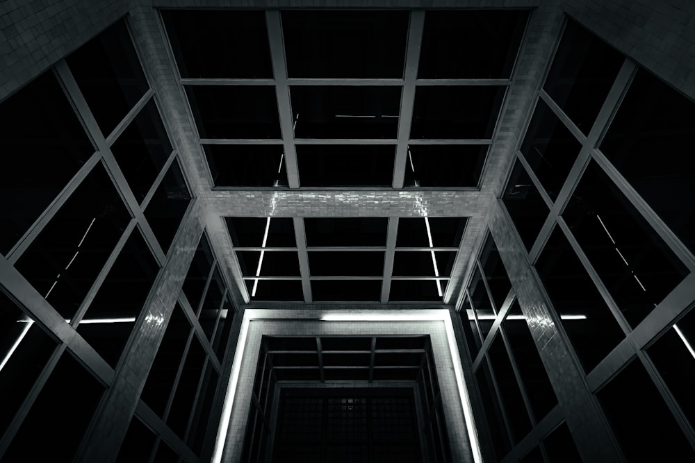 a black and white photo of a room with a ceiling