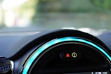 Close-up of a car dashboard with safety system diagnostics displayed.