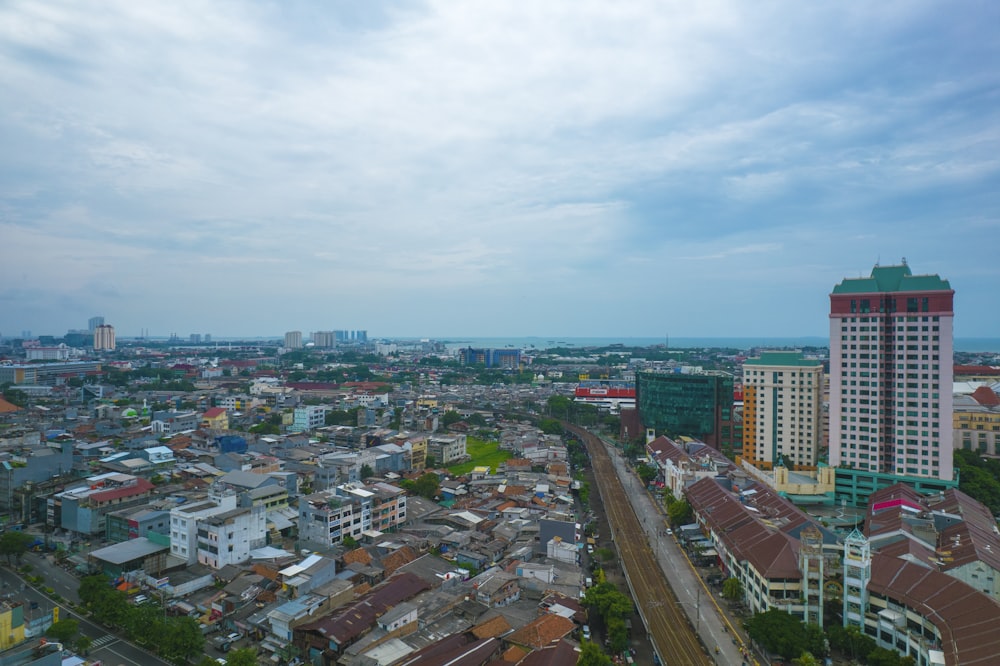 an aerial view of a city with tall buildings