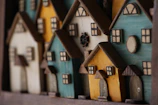 An array of miniature houses lined up, each telling its own quiet story.