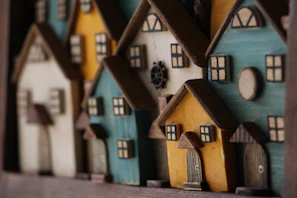 An array of miniature houses lined up, each telling its own quiet story.