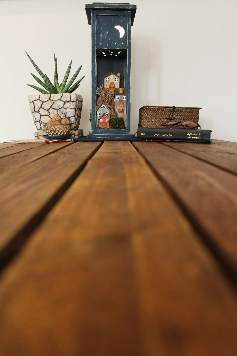 a wooden table with a clock on top of it