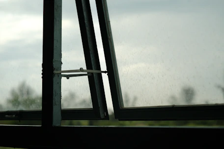 a window with a view of the sky and trees