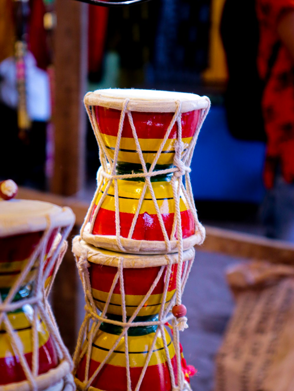 a group of red and yellow drums sitting next to each other