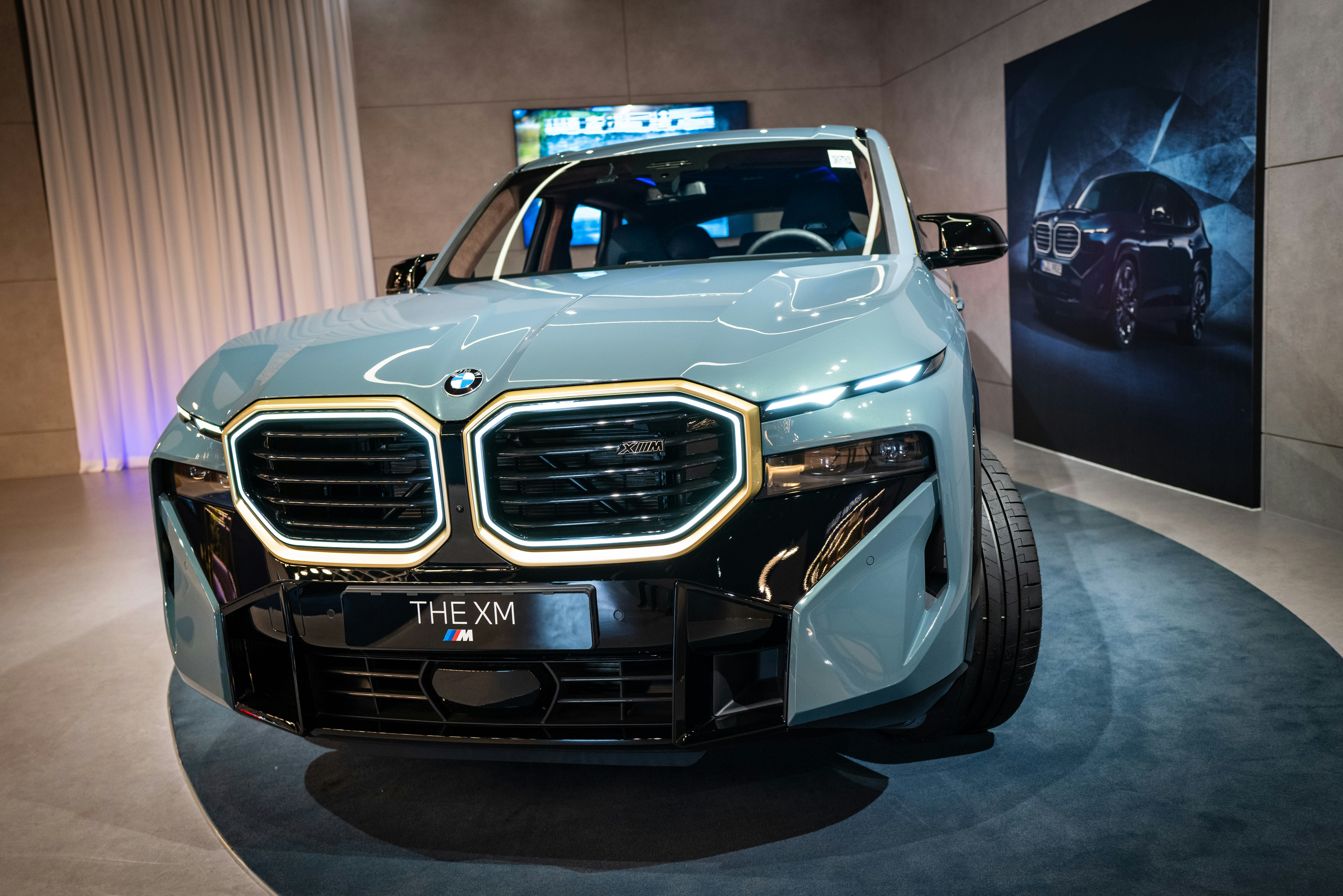 Dark BMW XM luxury SUV on highway