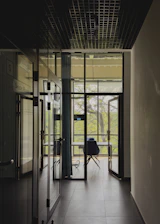 a room with a chair and a glass door