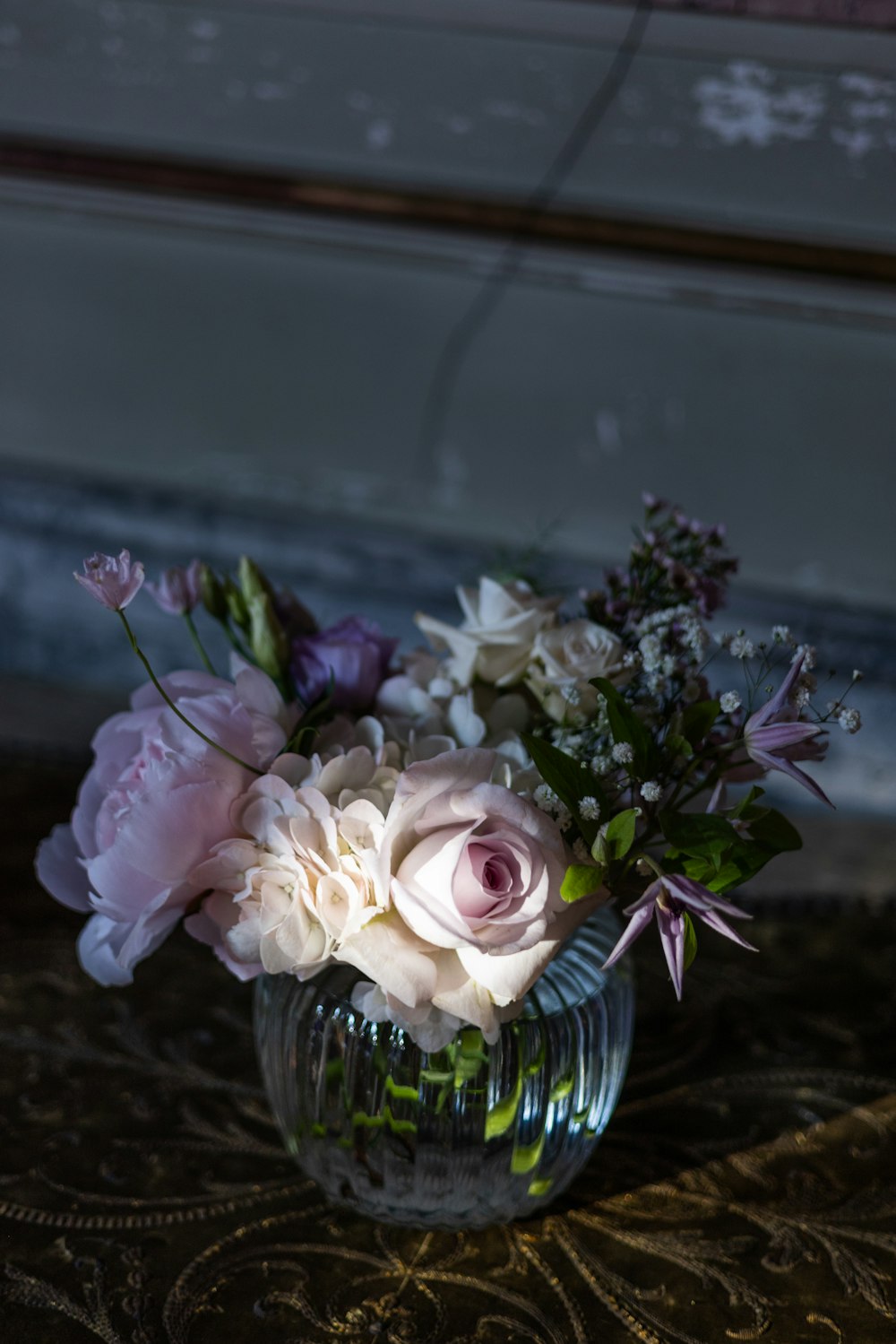 a vase filled with flowers on top of a table