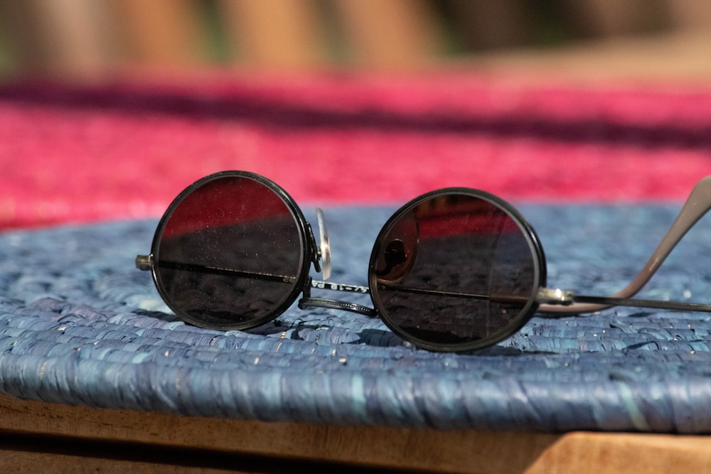 a pair of sunglasses sitting on top of a table