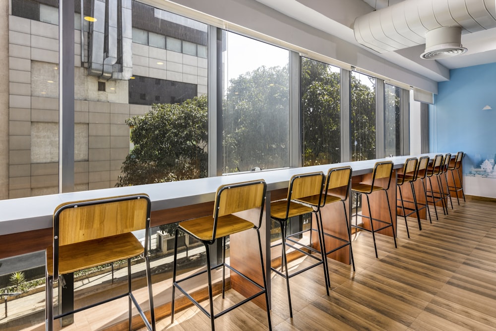 a row of chairs sitting in front of a window