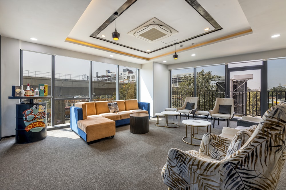 a living room filled with furniture and a large window