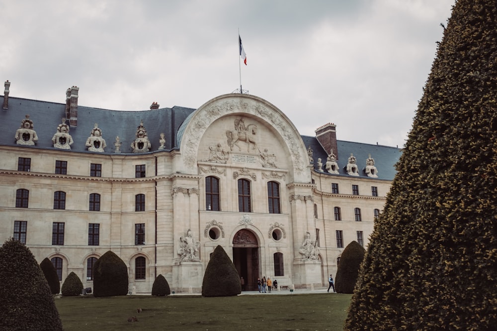 a large building with a flag on top of it