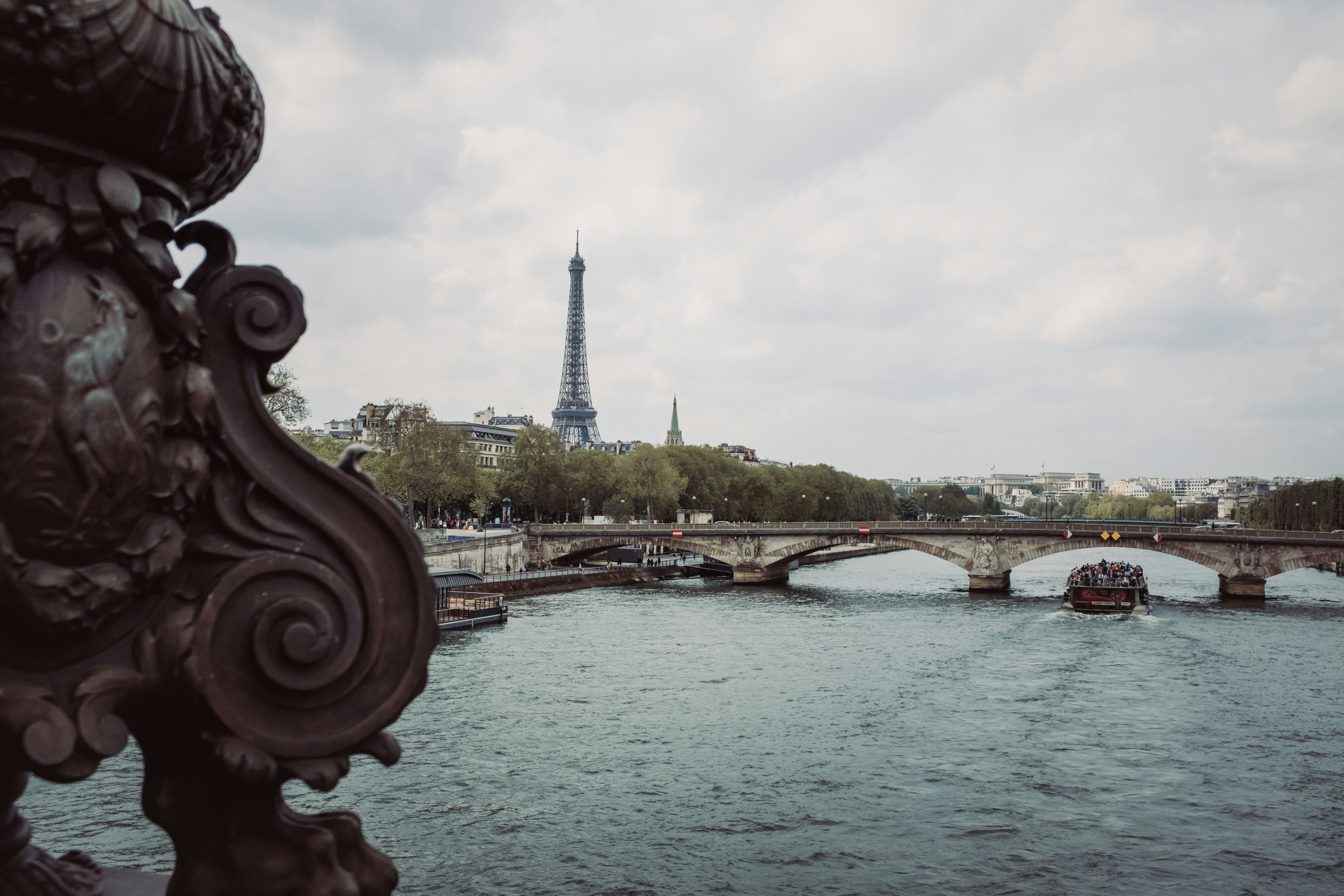 a view of the eiffel tower from across the river