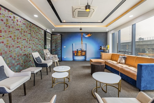 A vibrant lounge area with comfortable seating and art.