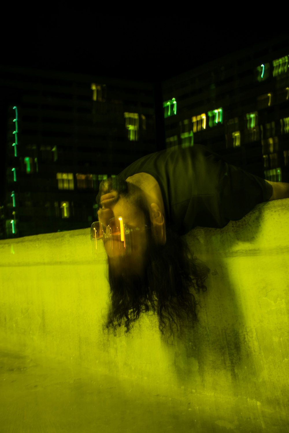 a man is doing a handstand on a ledge