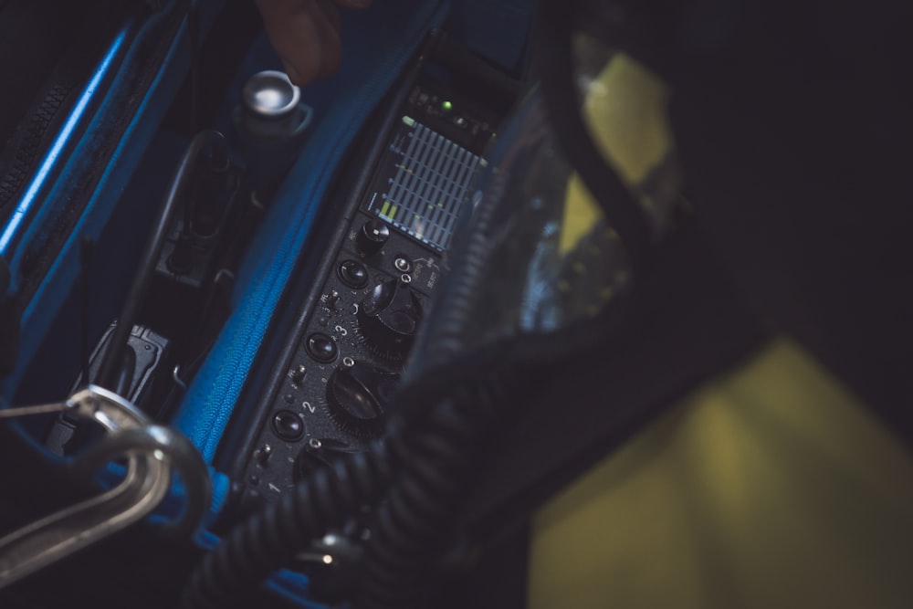 a close up of a blue case with buttons and wires