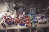 A close-up of a meeting table with snacks and drinks prepared.