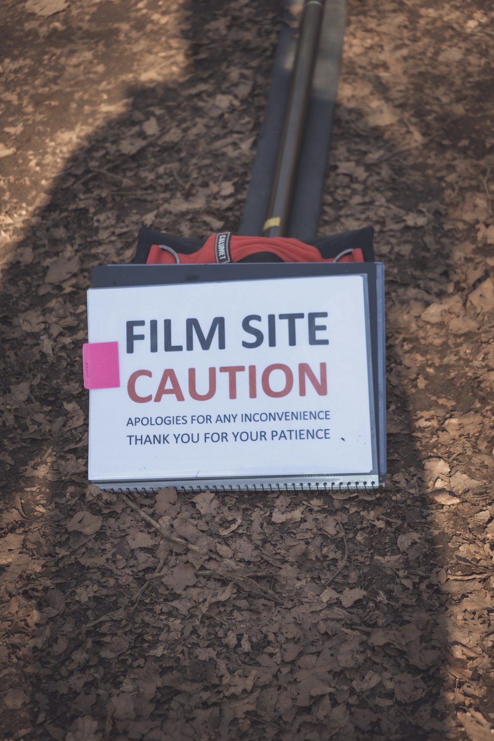 a sign on the ground that says film site caution