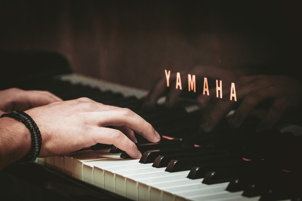 a close up of a person playing a piano